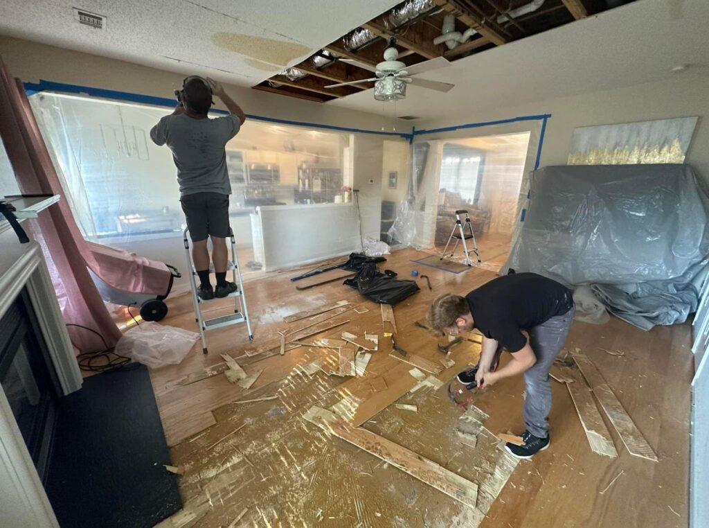 Fire restoration cleanup in progress with a crew removing damaged materials, by Property Restoration Pros