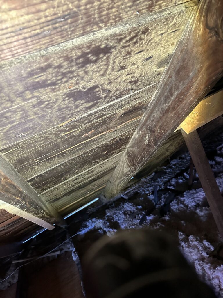 Soot and smoke damage on structural framing after a house fire, documented by Property Restoration Pros