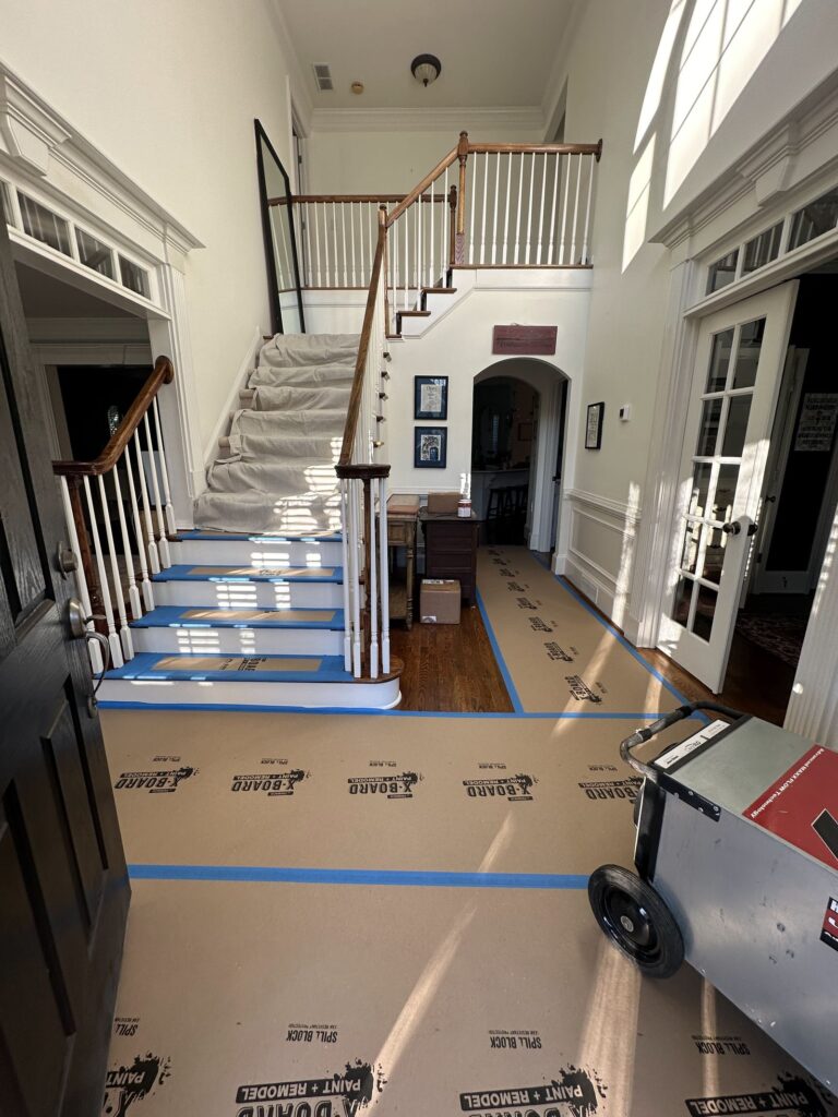 Floor protection laid down during a water damage restoration job by Property Restoration Pros