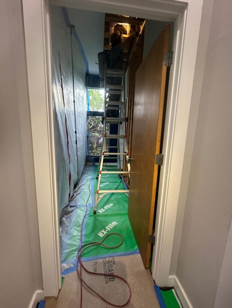 Containment barrier set up to keep mold spores from spreading during remediation