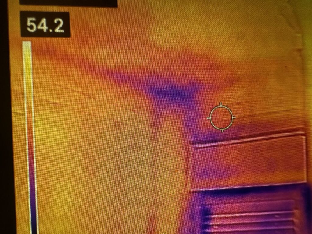 Thermal imaging camera detecting hidden moisture during a water damage inspection by Property Restoration Pros